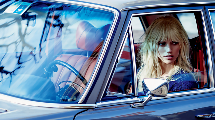 Devon Windsor in a vintage car