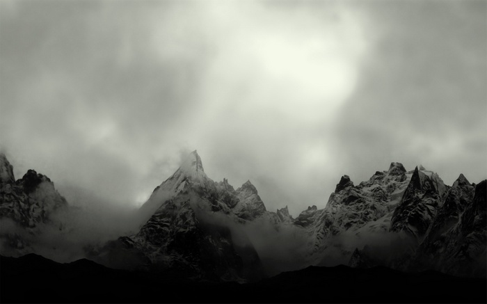 Monochrome mountain landscape with mist