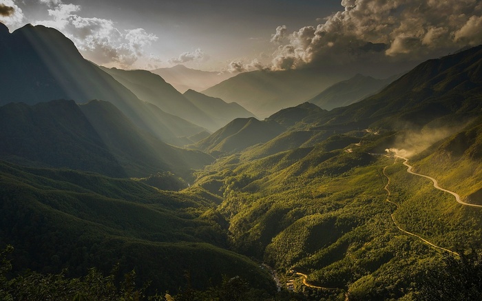 Sun rays over a misty valley in Vietnam