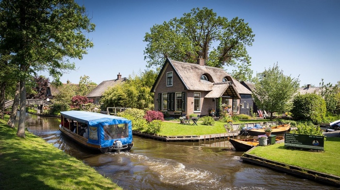 Boat tour on canal in Giethoorn, Netherlands