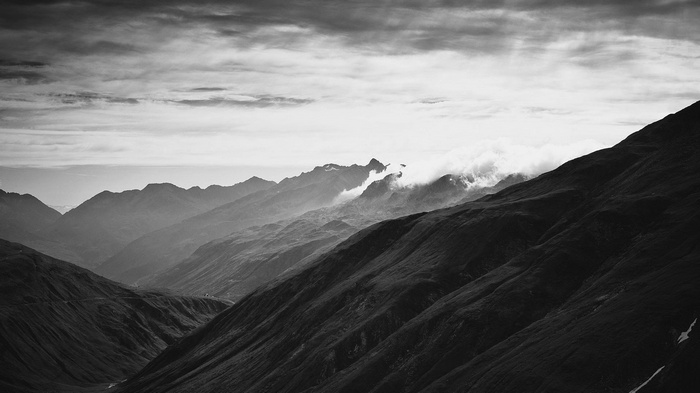 Monochrome mountain landscape with mist