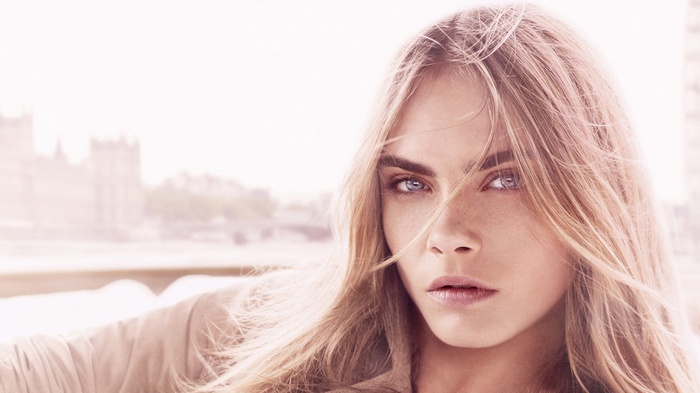 Cara Delevingne portrait with London skyline