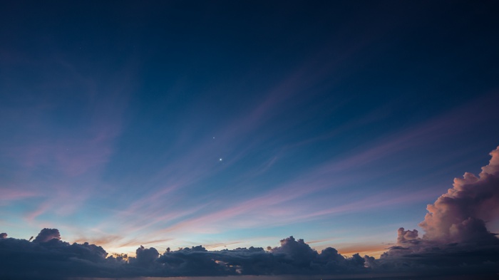 Evening sky with clouds and stars