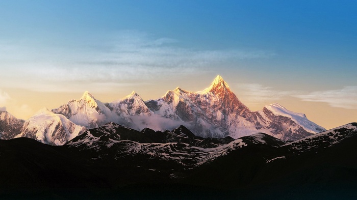 Snow-capped mountains at sunrise