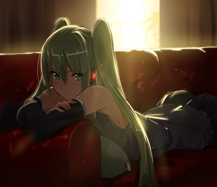 Hatsune Miku lying on a red couch