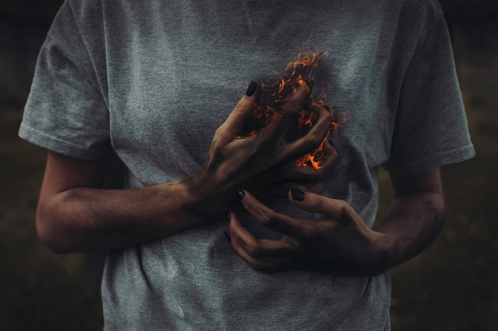 Person with hands on fire