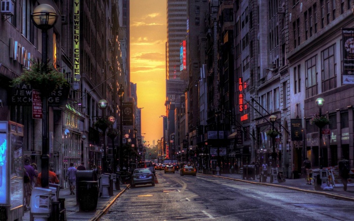 New York City street at sunset with cars and buildings