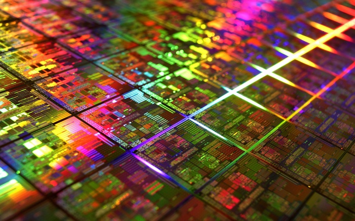 Colorful silicon wafer with microchips and geometric patterns
