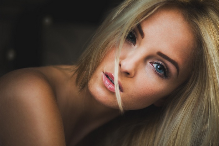 Close-up of a blonde woman with blue eyes