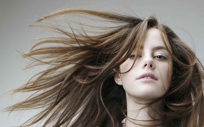 Kaya Scodelario with windblown brown hair