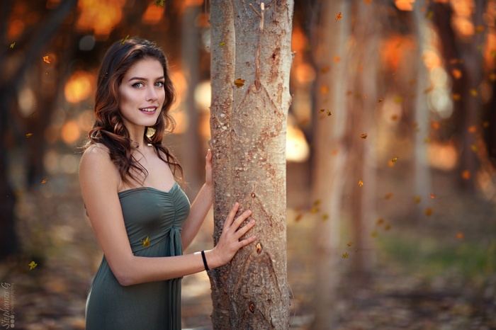 Portrait of a woman in a green dress outdoors