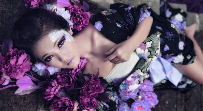 Asian woman with purple flowers and kimono