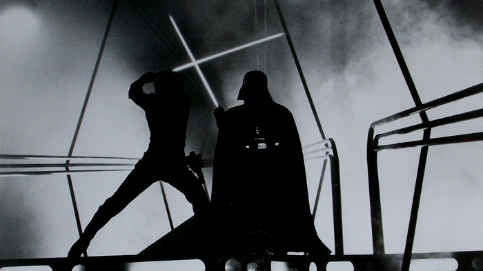 Darth Vader and Luke Skywalker duel with lightsabers