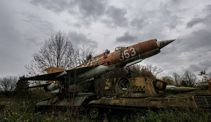 Abandoned MiG-21 fighter jet on a tank