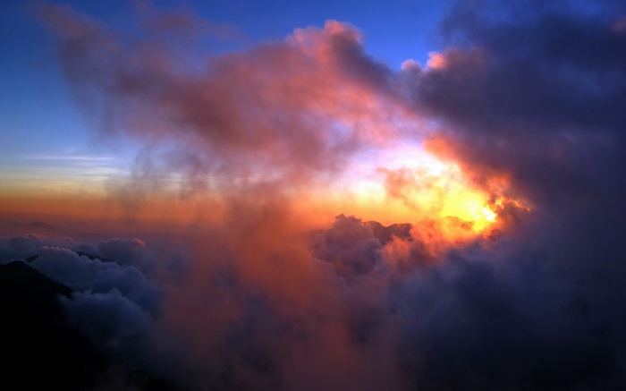 Sunset clouds over mountains, photography