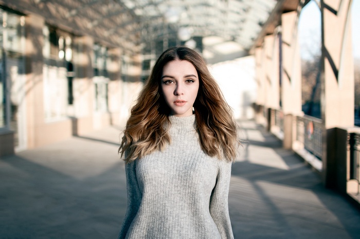 Portrait of a young woman in a grey sweater