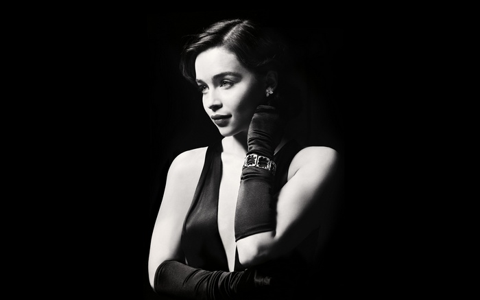 Emilia Clarke in a black dress and gloves