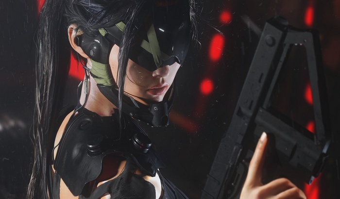 Futuristic woman with a gun