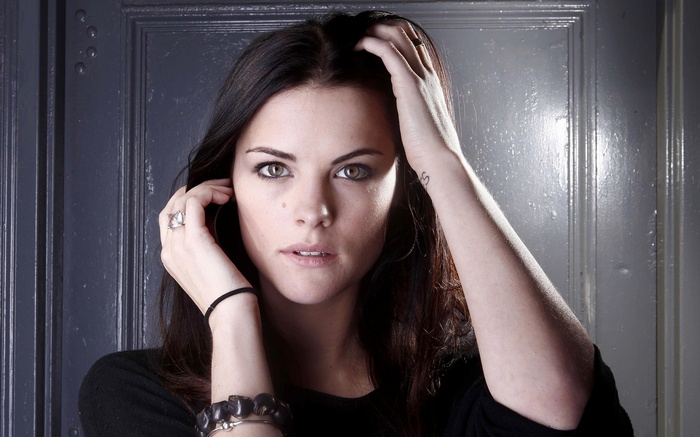 Jaimie Alexander with hands on head