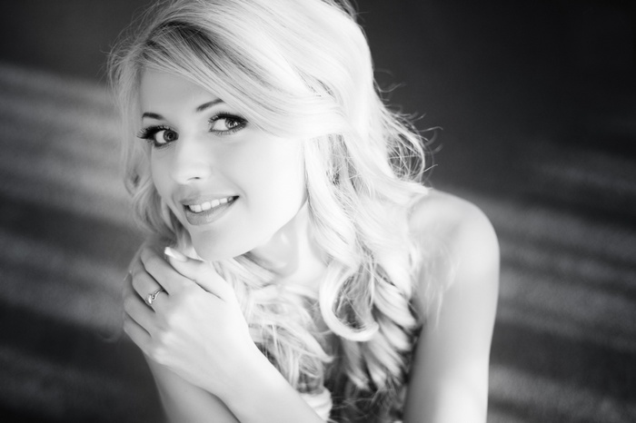 Monochrome portrait of a blonde woman looking at viewer