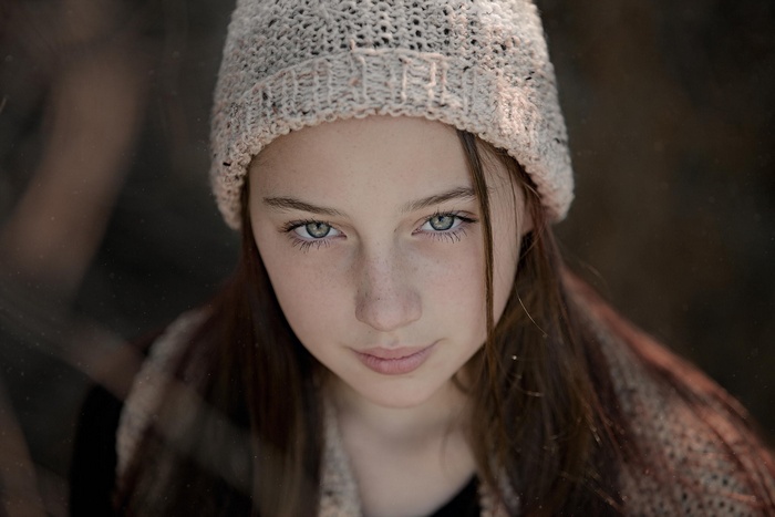 Portrait of a young girl wearing a knitted hat