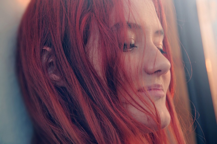 Portrait of a redhead woman with vibrant hair