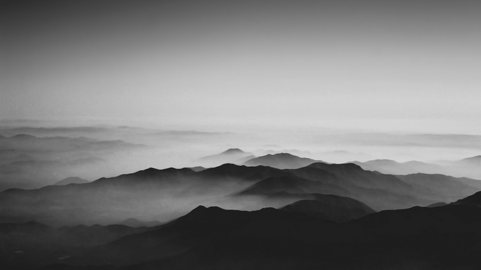 Monochrome mountains shrouded in mist