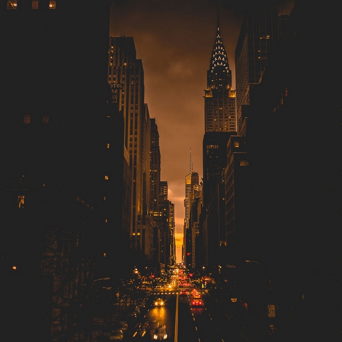 New York City street at dusk with Chrysler Building