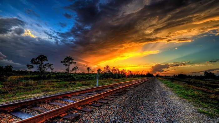 Sunset over railway tracks