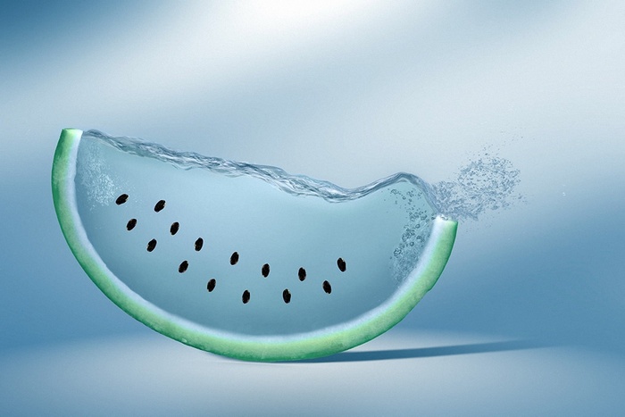 Watermelon slice with water and seeds