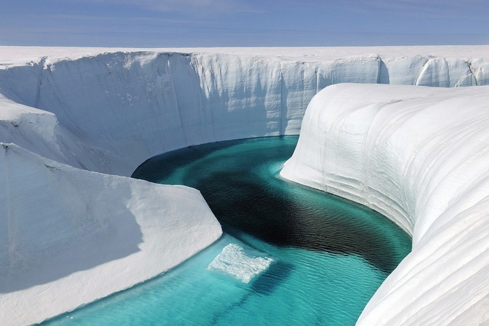 Arctic ice canyon with turquoise water