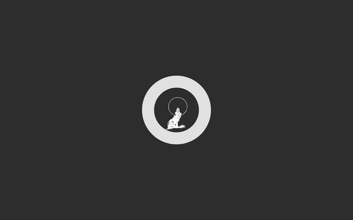Wolf howling at the moon inside a circle