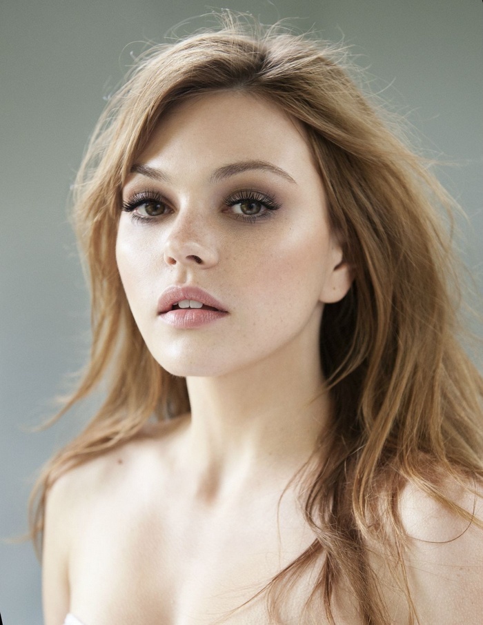 Aimee Teegarden portrait with long brown hair and bare shoulders