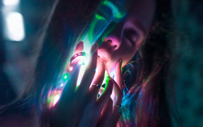 Woman with colorful lights
