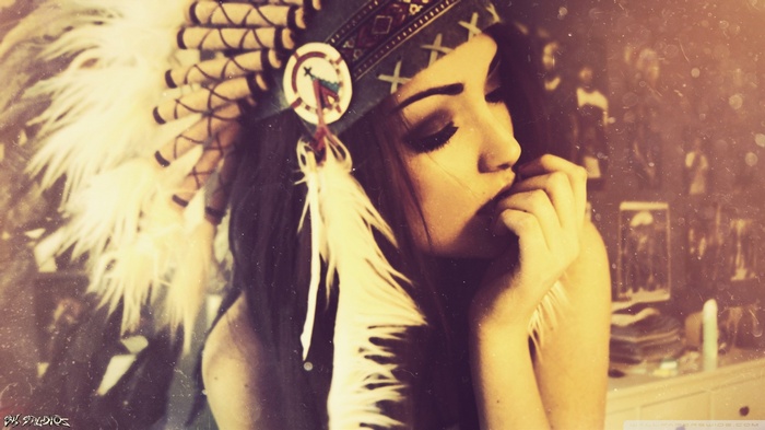 Woman wearing a Native American headdress