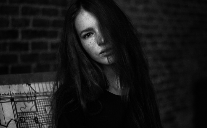 Woman with hair covering her face