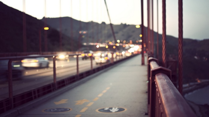 Golden Gate Bridge traffic at dusk with depth of field