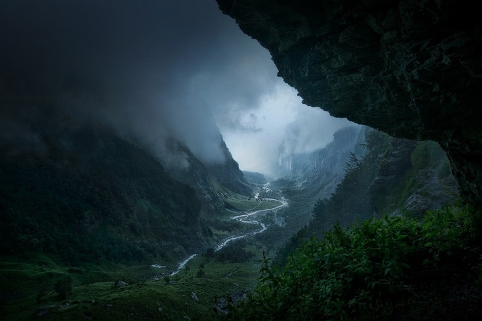 Misty valley with a winding river in France