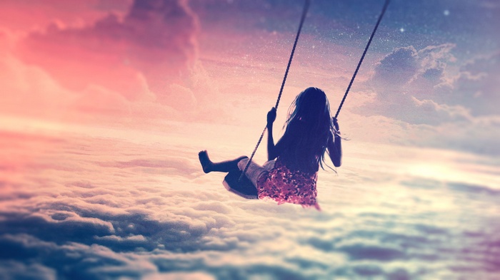 Girl on a swing in the clouds