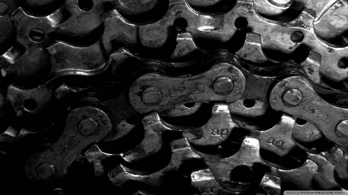 Macro view of a dirty bicycle chain and gears