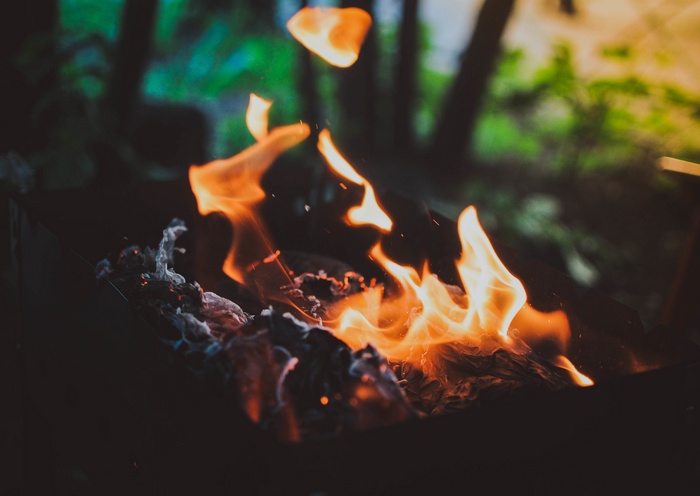 Close-up of fire burning in a dark setting