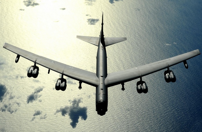 Boeing B-52 Stratofortress bomber flying over the sea