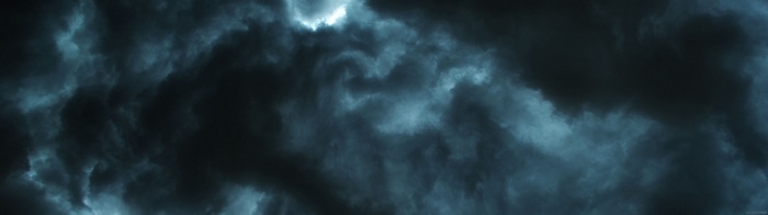 Dark stormy clouds with light breaking through
