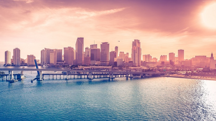 Miami skyline with bridge over the bay at sunset