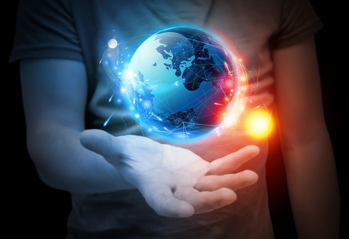 Digital art of a glowing Earth held in hands