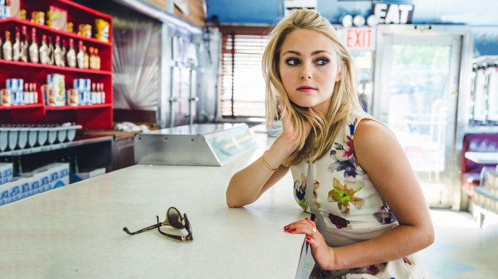 AnnaSophia Robb sitting at a diner counter