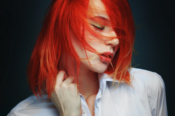 Portrait of a redhead woman with closed eyes