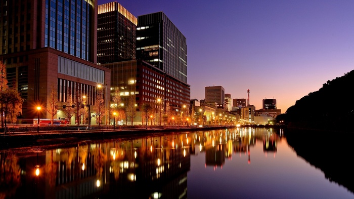 City skyline reflected in water at dusk