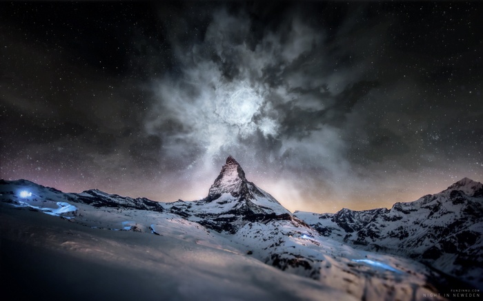 Matterhorn mountain under a starry night sky