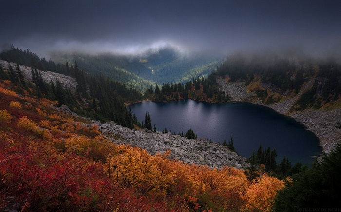 Autumn lake in the mountains with mist